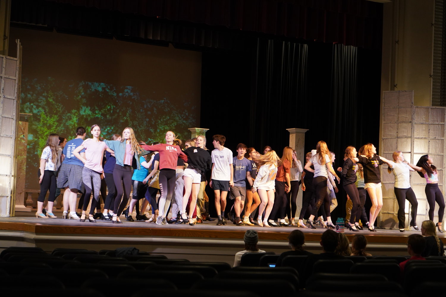 Members of the cast of Helias Catholic High School’s spring musical production of “Anastasia” rehearse a singing and dancing number on the stage of the Miller Performing Arts Center in Jefferson City on March 1.